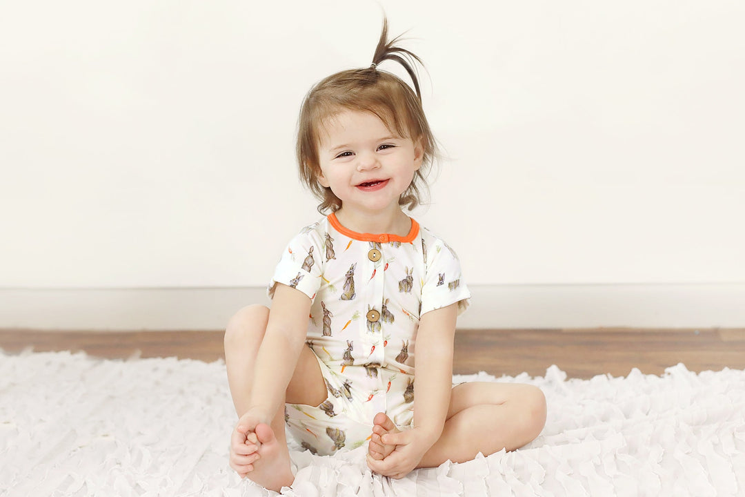 Hoppin’ Bunnies & Carrot Patch Short Two-Way Zippy Romper with Faux Buttons (0-24m)